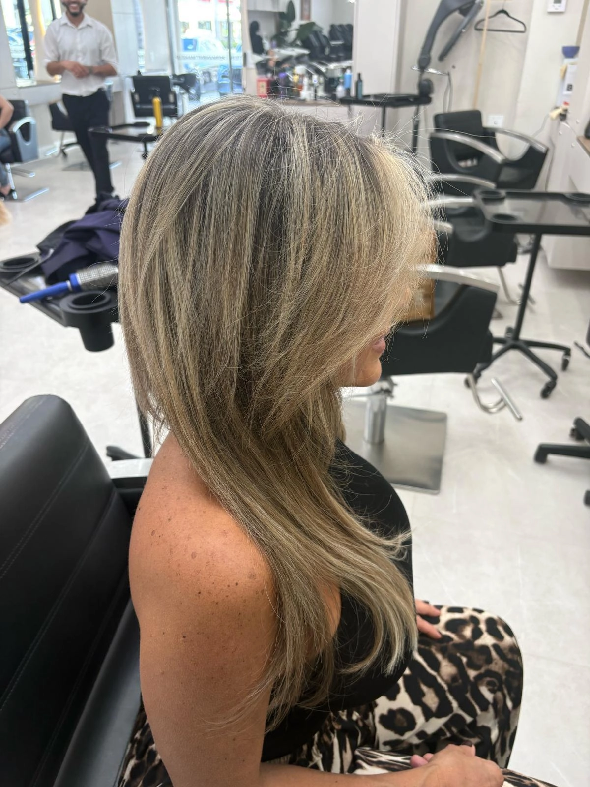 Golden layered blonde in the salon chair